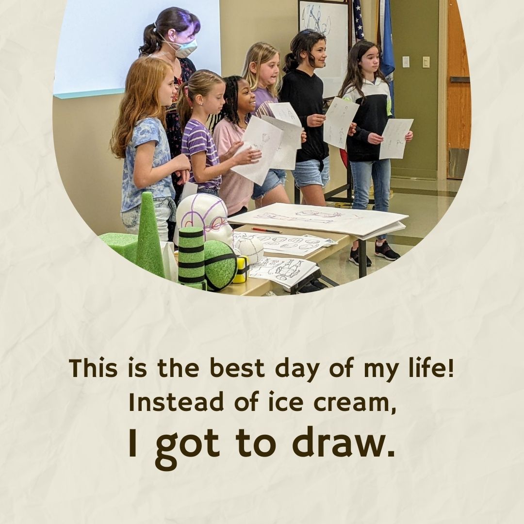 Becca having taught a class full of students how to draw anything! The best day of their life.
