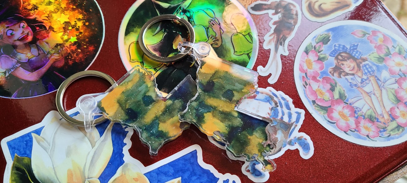 An acrylic keychain of the state of Louisiana in watercolor