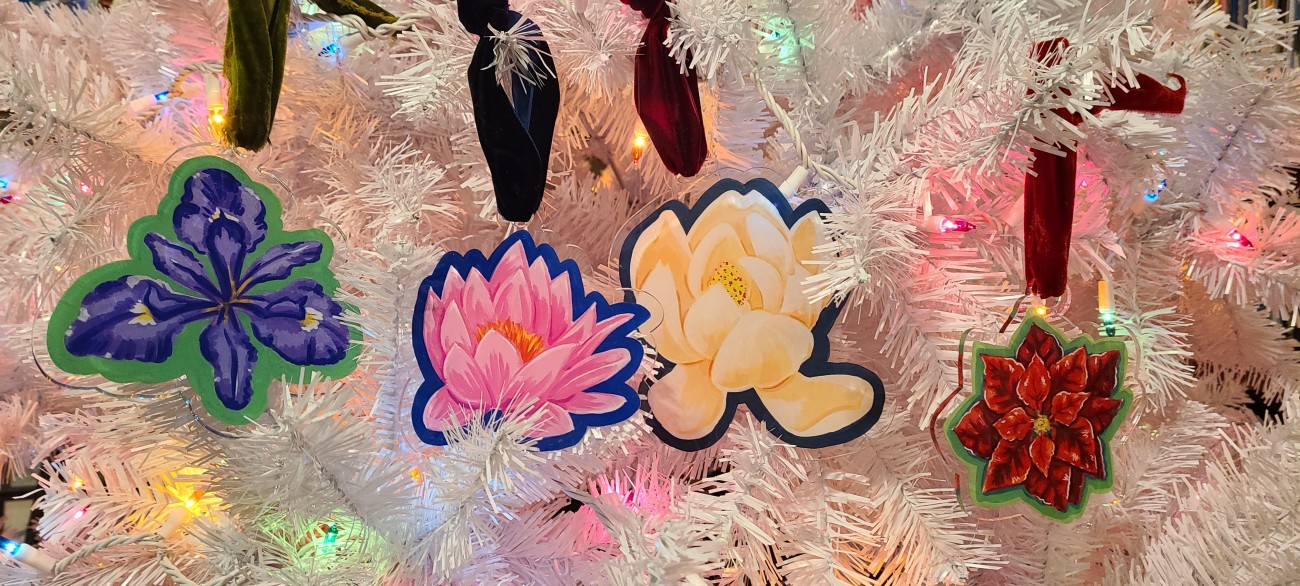 All four flower ornaments on a white Christmas tree