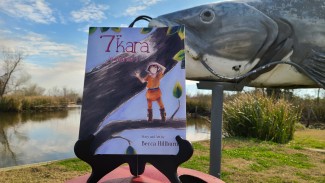 7" Kara Volume 1 in front of a giant catfish
