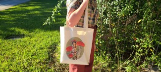 Natural cotton tote bag featuring a girl wearing a red straw hat, surrounded by red topped fly agaric mushrooms.