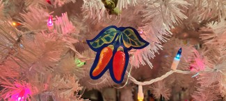 Tabasco pepper acrylic ornament on a white Christmas tree