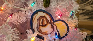 Oyster acrylic ornaments on a white Christmas tree